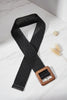 Braided black belt with wooden buckle, flat lay
