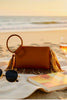Cuff tassel wristlet clutch top view
