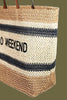 Braided straw tote bag, side view
