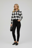 Black and white diamond shape long sleeve button-down blouse, front view