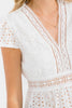 Eyelet peplum top with ruffle sleeves in white