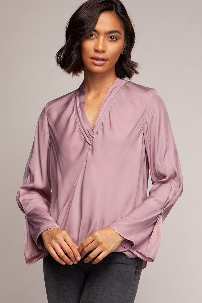 Surplice neckline twisted front blouse styled