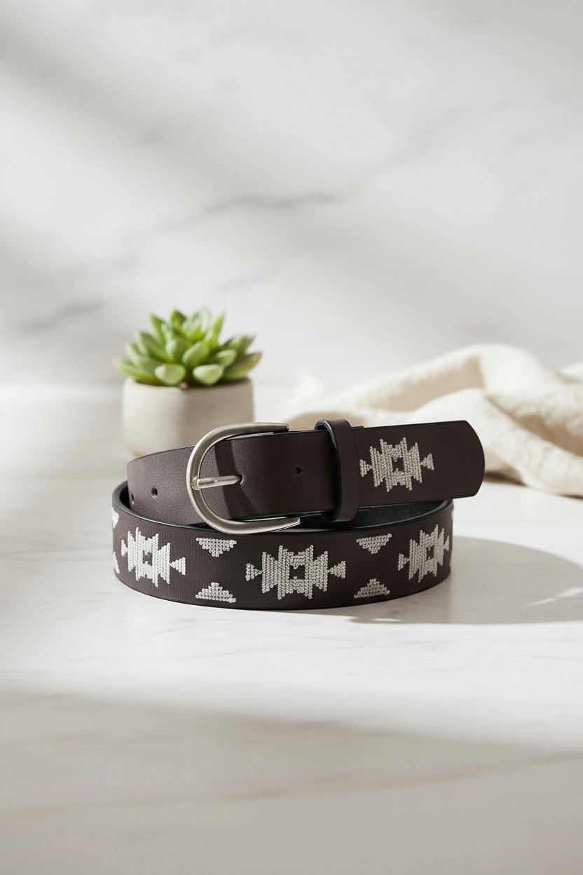 Black belt with white pattern on a white background