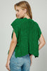 Cable knit sweater vest layering look