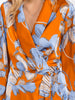 Wrap dress with high-low hem and warm sunset tones