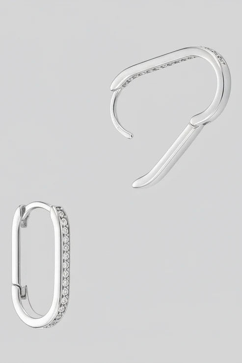 Gold dipped slim oval hoop earrings with sparkle