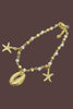 Gold tone shell layered necklace side view