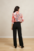 Long-sleeve pink animal print blouse, back view