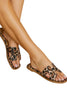Leopard print slip-on sandal styled on foot, outdoor shot