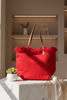 Red braided fringe canvas tote bag, front view