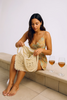 Straw braided fringe tote bag, lifestyle carry view