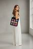 Boho straw tote bag with black floral patch