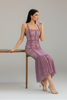 Blushing mauve lace midi dress flowing from knee