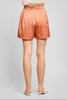 Wide leg satin pleated shorts in peach blush