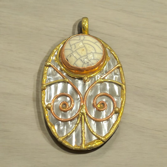Stainless Steel pendant with brass/copper