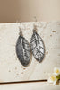 Antique silver feather earrings close up