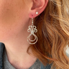 Elegant silver earrings styled