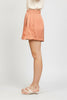 Golden pleated satin wide-leg shorts detail