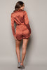 Polka dot belted romper with long sleeves