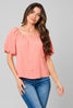 Peach button-down blouse with puff sleeves