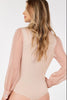 Sheer blouse V-neck bodysuit, close-up of neckline