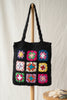Boho Bloom braided straw tote with black floral patch