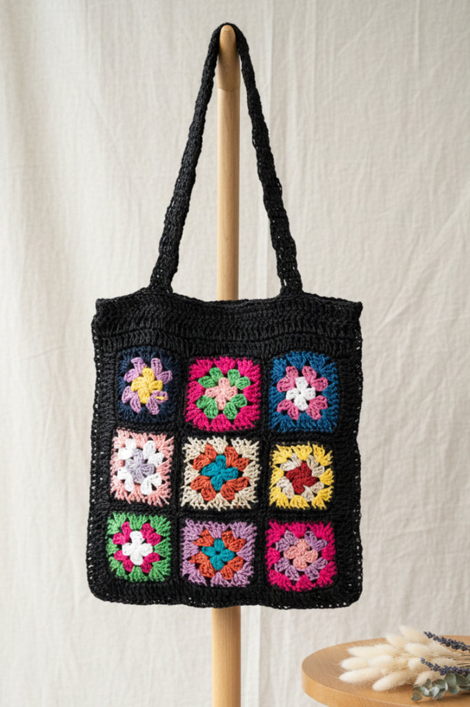Boho Bloom braided straw tote with black floral patch