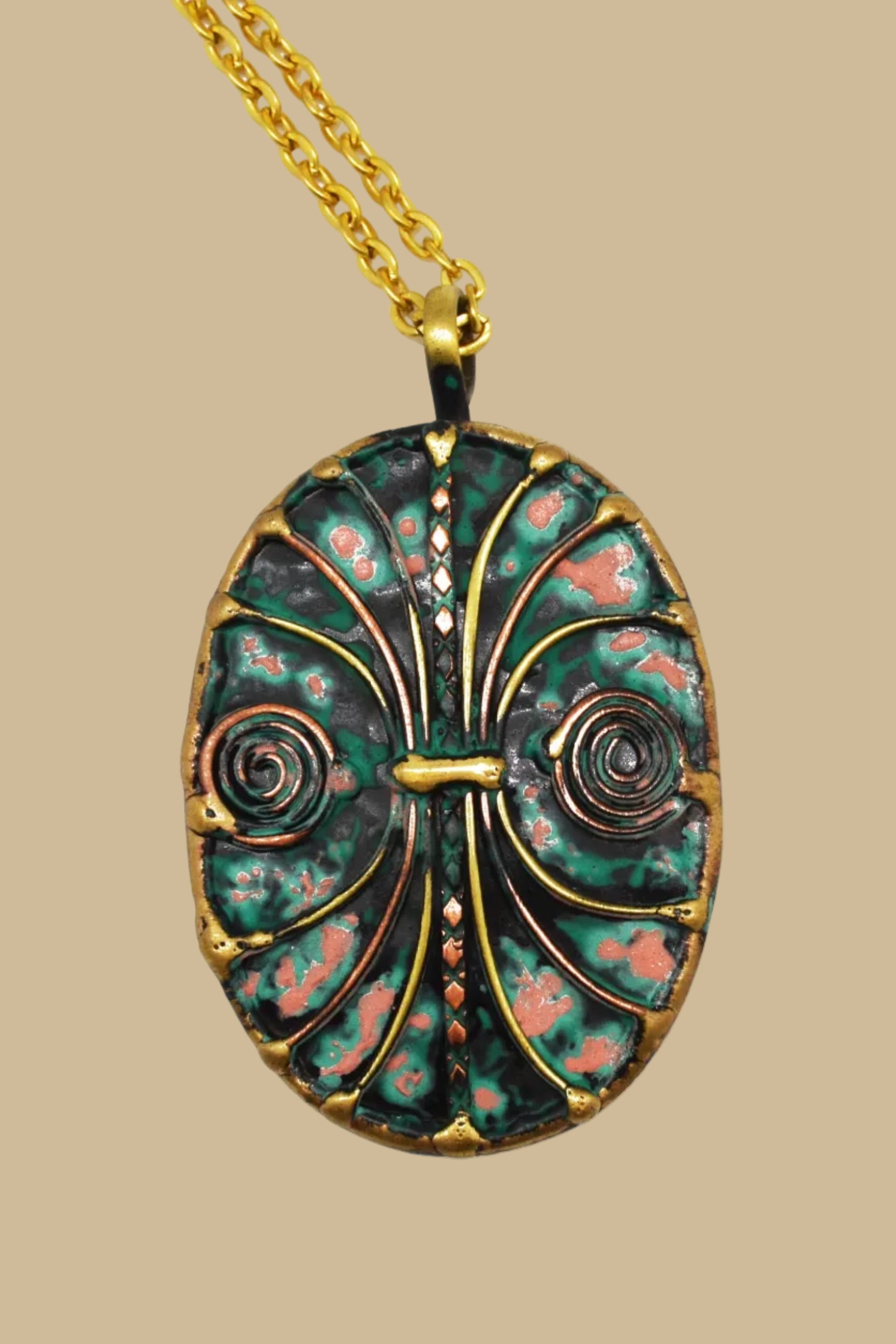 Brass and Copper with Blue/Green Patina Oval and spirals necklace
