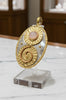 Mixed metal pendant in silver and gold tones