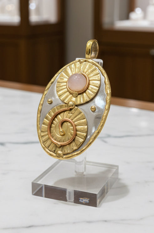 Mixed metal pendant in silver and gold tones