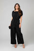 Midnight clinch puff sleeve jumpsuit in cotton, styled on model