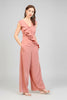 Wide-leg ruffle jumpsuit showing graceful fabric movement