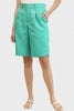 Back elastic waist bermuda shorts in sea green, styled on model