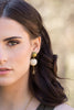 Handmade raffia wood earrings close up