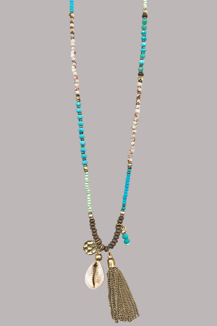 Handmade Sachi necklace with beads, metal disc, puka shell, metal tassels.