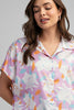 Floral button-down top with short sleeves