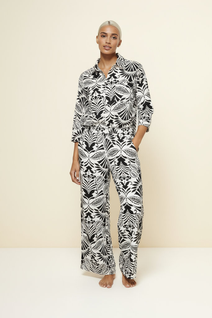 Black and white botanical button-down top and wide-leg pants set, front view