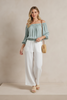 Printed off-shoulder top, full-length model view