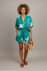 Vibrant floral print button-down shirt with elastic waist shorts